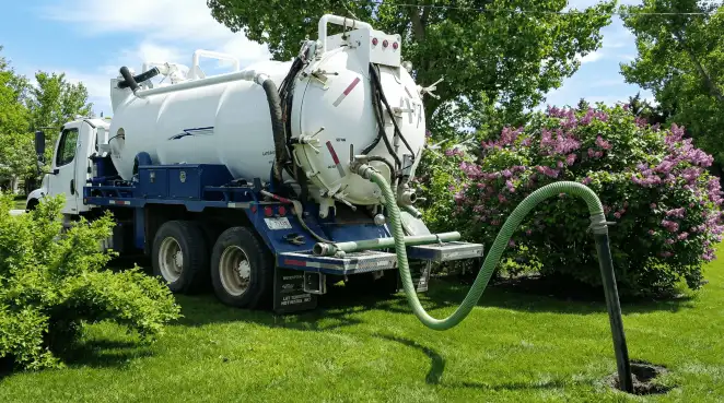Professional vacuum truck performing residential drainage and septic maintenance in Lincoln, NE